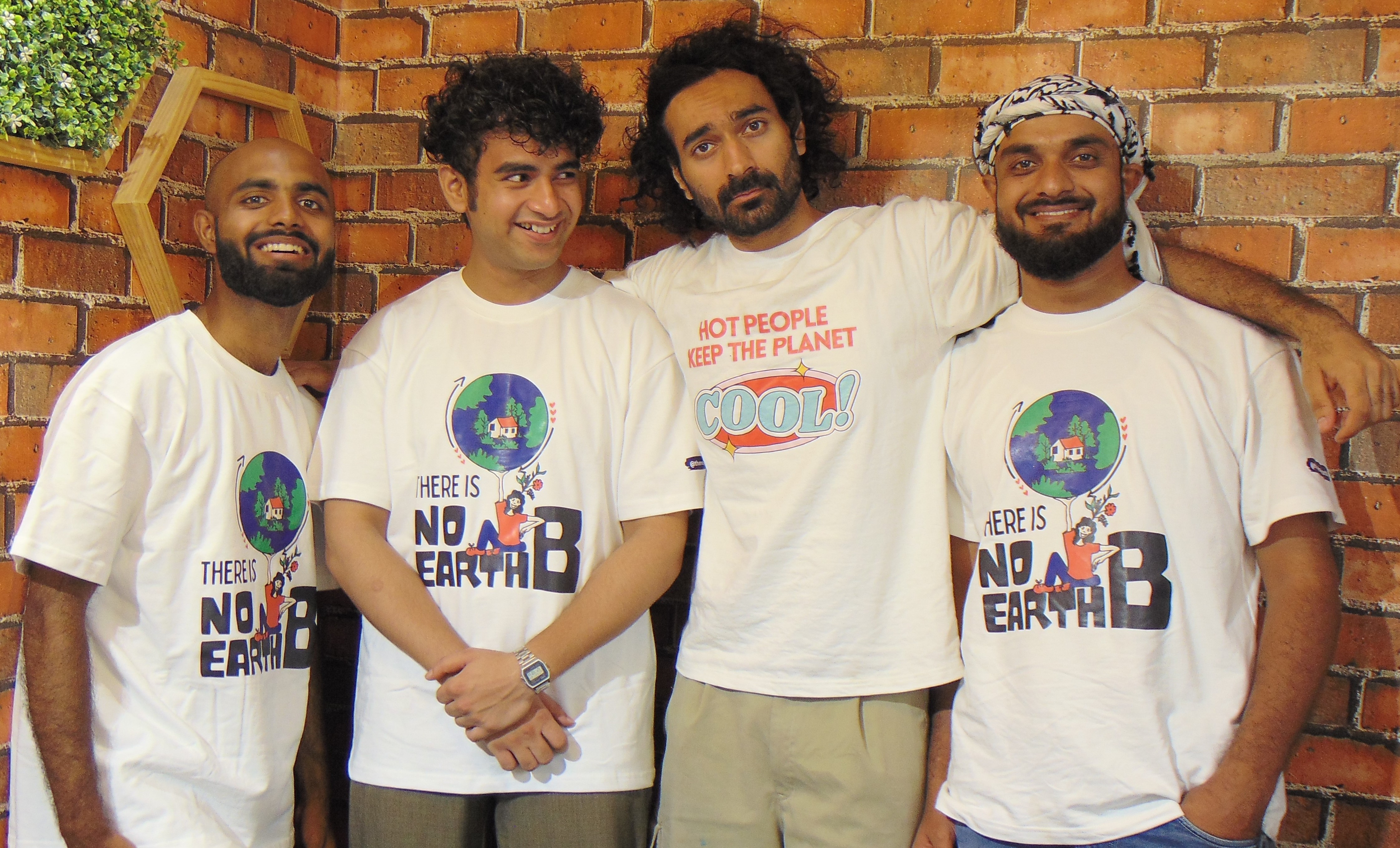 People wearing a t-shirt called 'There Is No Earth B'
